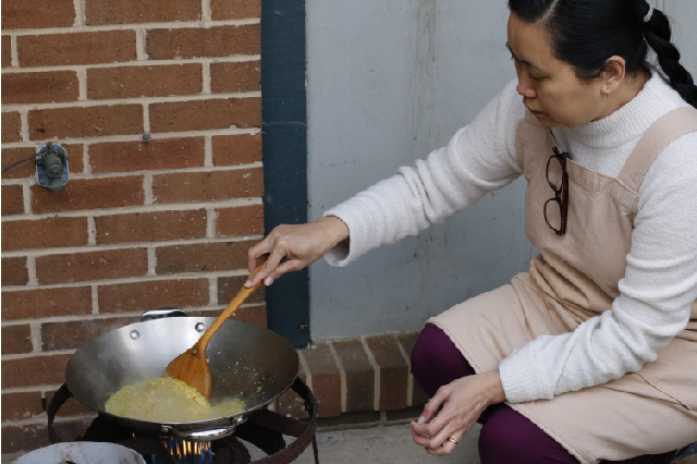 Ma Yu Thin stirs the wok